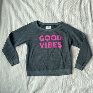 Evereve sweatshirt says “Good Vibes” in hot pink on front. Excellent condition!
